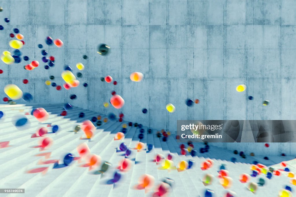 Large group of glowing spheres falling down the urban concrete stairs