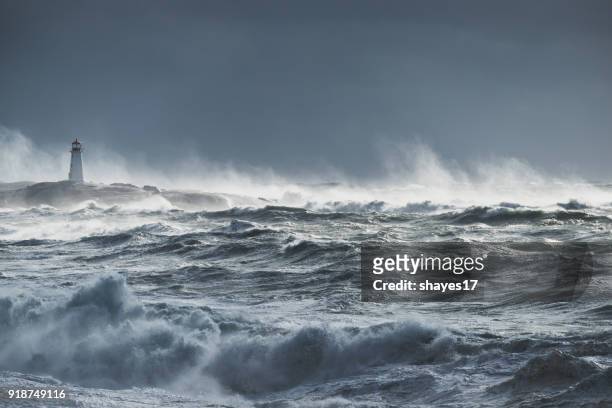turbulent ocean lighthouse - extreme weather stock pictures, royalty-free photos & images