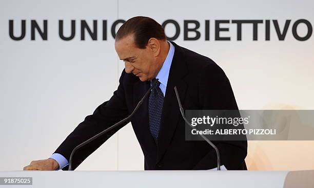 Italy's Prime minister Silvio Berlusconi delivers a speech during a meeting about the new hubs of Rome's Fiumicino and Milan's Malpensa airports on...