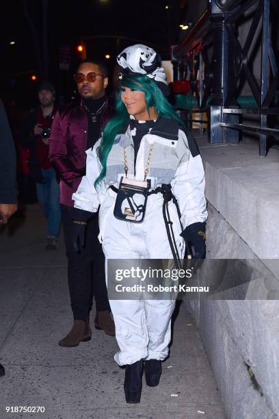 Lil' Kim seen leaving a New York Fashion event in Manhattan on February 14, 2018 in New York City.