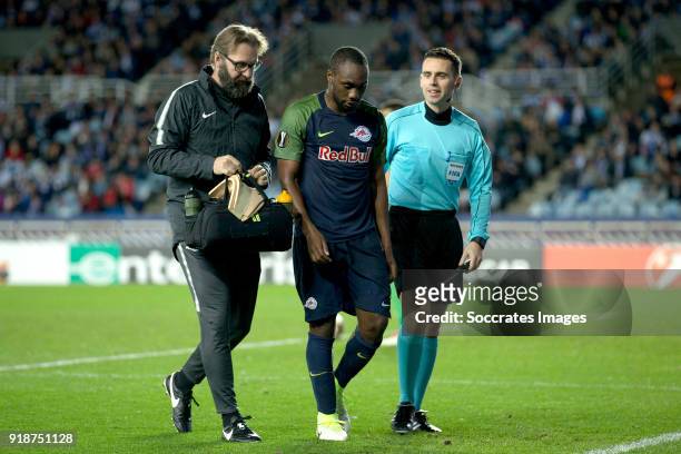 Reinhold Yabo of Red Bull Salzburg is leaving the pitch injured during the UEFA Europa League match between Real Sociedad v Salzburg at the Estadio...