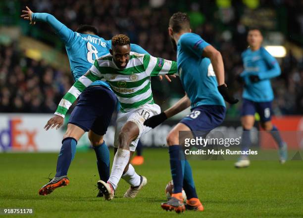 Moussa Dembele of Celtic is challenged by Matias Kranevitter of Zenit St Petersburg during UEFA Europa League Round of 32 match between Celtic and...