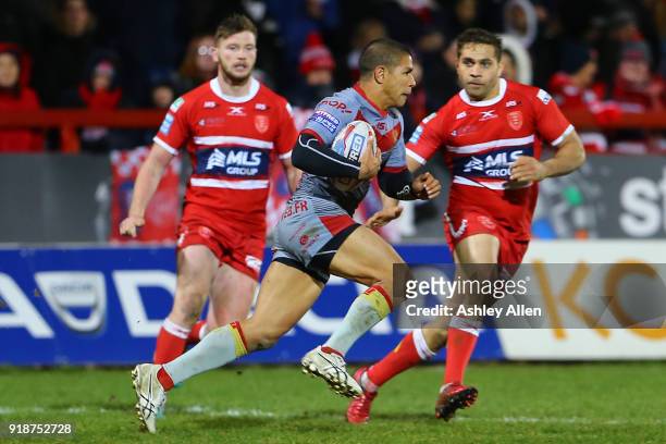 David Mead of the Catalans Dragons runs with the ball as Hull KR's Maurice Blair and James Greenwood give chase during the BetFred Super League match...