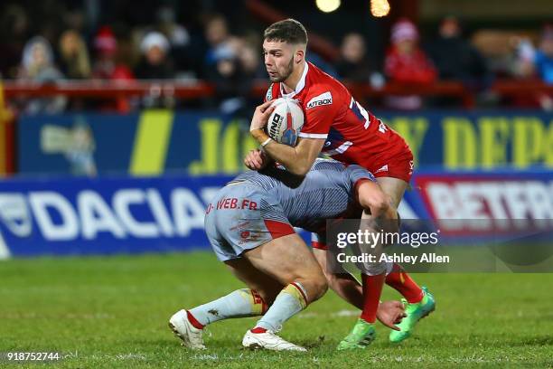 Will Dagger of Hull KR is tackled by Alrix Da Costa of the Catalans Dragons during the BetFred Super League match between Hull KR and Catalans...