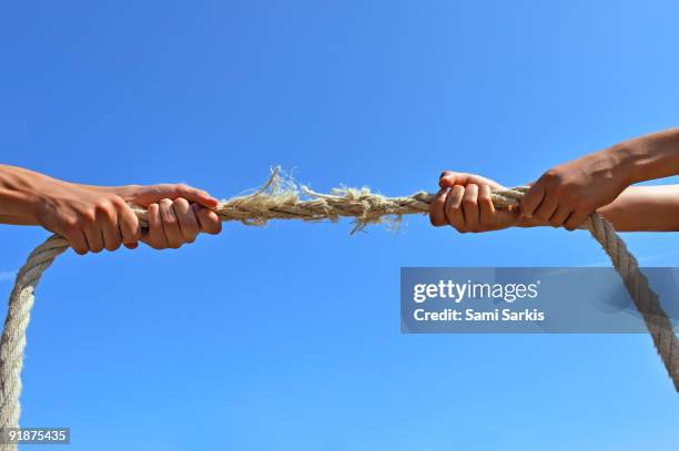 Two Hand Rope Pull 189 Two Hands Pulling A Rope Stock Photos, High-Res Pictures, and ...