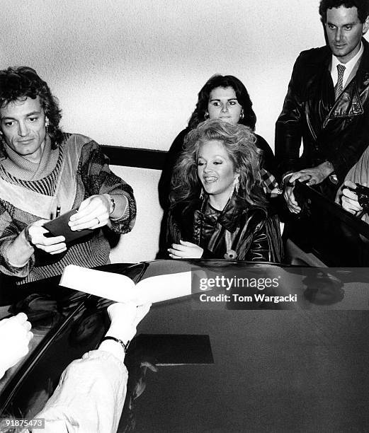 S: Charlene Tilton and her husband helping with the signing of autographs at the "Terry Wogan Show" on circa 1980's in London, England.