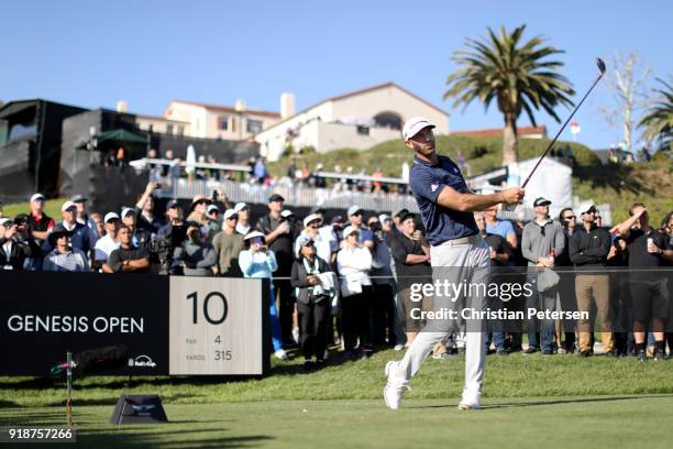 Dustin Johnson plays his shot from the 10th tee during the first round of the Genesis Open at Riviera Country Club on February 15, 2018 in Pacific...