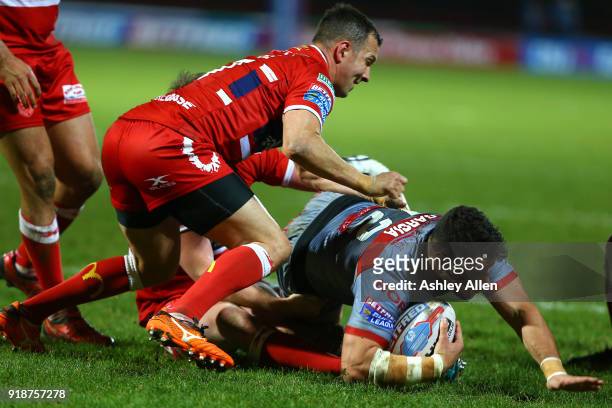 Danny McGuire of Hull KR tackles Benjamin Garcia of the Catalans Dragons during the BetFred Super League match between Hull KR and Catalans Dragons...