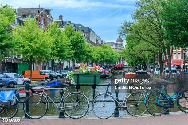 view of amsterdam canal, netherlands - amstel stockfoto's en -beelden