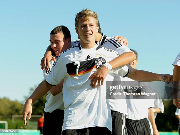 Mirco Born of Germany celebrates after scoring the first goal with his team mates during the U16 international friendly match between Germany and...