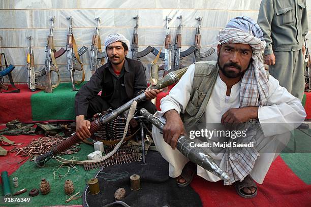 Taliban fighters lay down their weapons as they surrender to the government of Herat Province on October 14, 2009 in Western Afghanistan. More than...