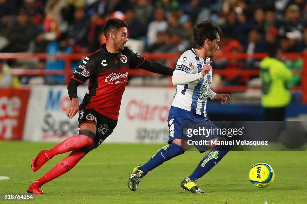Jorge Hernandez of Pachuca struggles for the ball with Juan Lucero of Tijuana during the 7th round match between Pachuca and Tijuana as part of the...