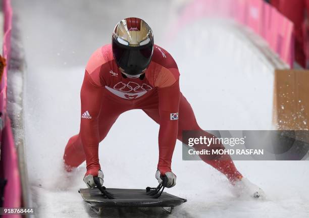 South Korea's Yun Sungbin slows down at the end of the mens's skeleton heat 3 run during the Pyeongchang 2018 Winter Olympic Games, at the Olympic...