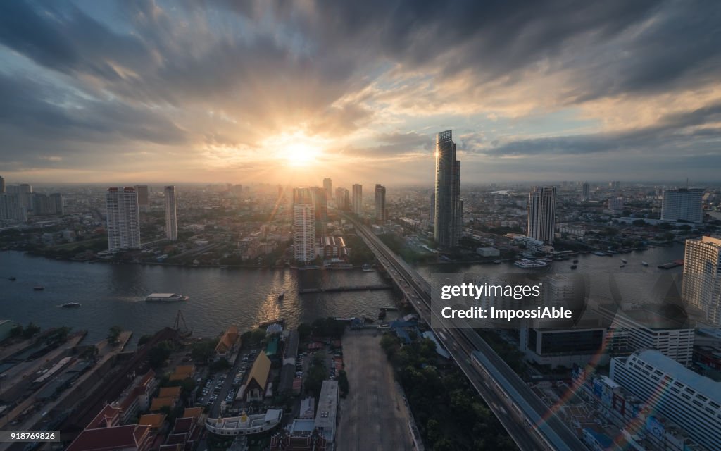 High angle view cities, building and Chaophraya river curve at sunset