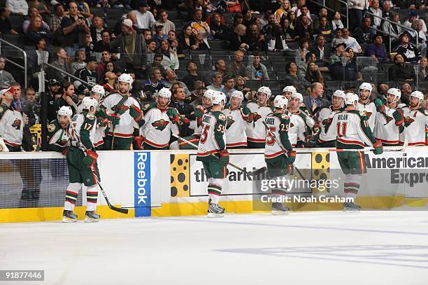 Petr Sykora, Nick Schultz, Eric Belanger and Owen Nolan of the Minnesota Wild celebrate with the bench against the Los Angeles Kings on October 8,...