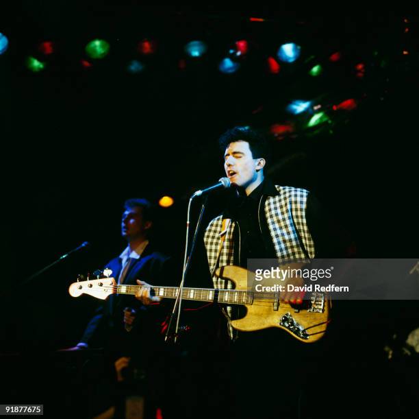 Paul Humphreys and Andy McCluskey of OMD perform on stage circa 1987.