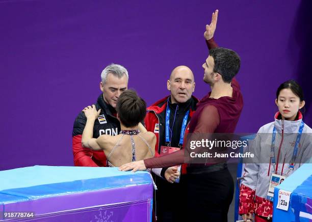 Meagan Duhamel and Eric Radford of Canada with their coach Bruno Marcotte during the Figure Skating Pair Skating Free Program on day six of the...