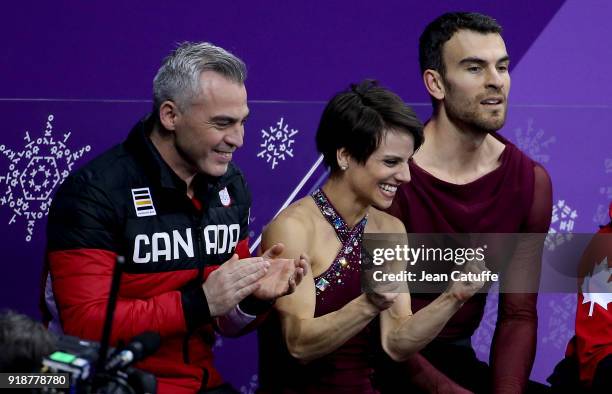 Meagan Duhamel and Eric Radford of Canada with their coach Bruno Marcotte during the Figure Skating Pair Skating Free Program on day six of the...