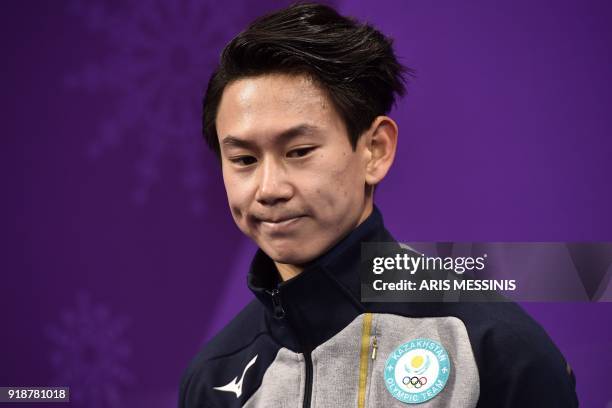 Kazakhstan's Denis Ten reacts after competing in the men's single skating short program of the figure skating event during the Pyeongchang 2018...