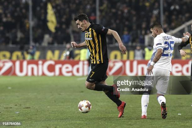 Derliz Gonzales of Dynamo Kiev and Lazaros Christodoulopoulos of AEK Athens vie for the ball during the UEFA Europa League round of 32 1st leg match...