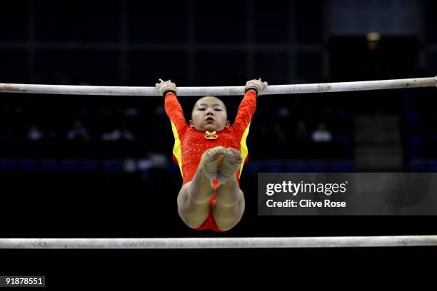 Kexin He of China competes in the uneven bars during the second day of the Artistic Gymnastics World Championships 2009 at O2 Arena on October 14,...