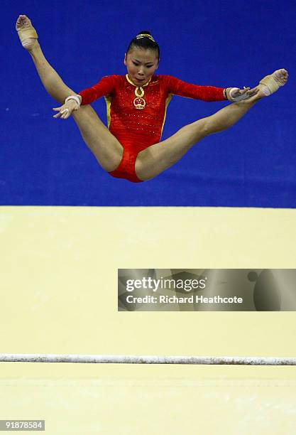 Kexin He of China competes in the uneven bars during the second day of the Artistic Gymnastics World Championships 2009 at O2 Arena on October 14,...