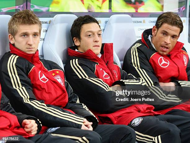 Marko Marin, Mesut Oezil and goalkeeper Tim Wiese of Germany sit on the substitute bench prior to the FIFA 2010 World Cup Group 4 Qualifier match...