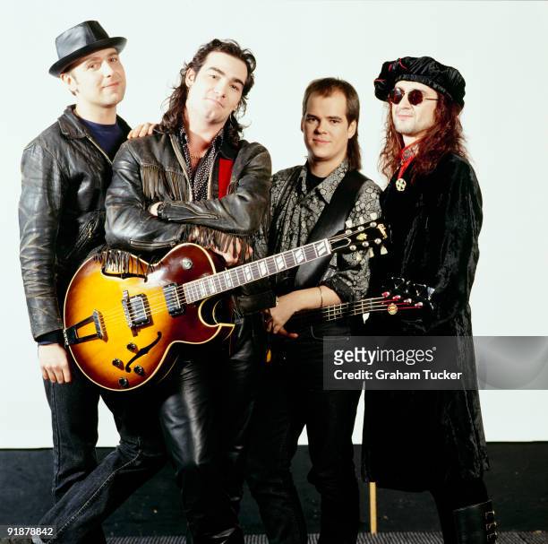 Posed group portrait of The Mission. Left to right are Mick Brown, Simon Hinkler, Craig Adams and Wayne Hussey in 1988.
