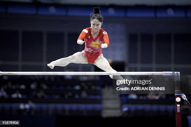 Japan's Miki Uemura performs in the uneven bars event during the Artistic Gymnastics World Championships 2009 at the 02 Arena, in east London, on...