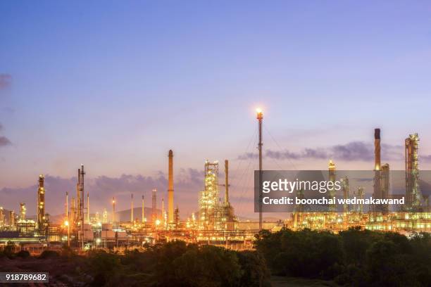 oil and gas refinery at twilight - petrochemical factory - refine stock pictures, royalty-free photos & images