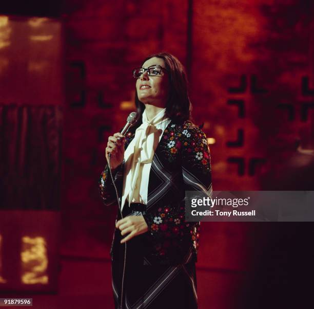 Singer Nana Mouskouri performs on a BBC television show in 1974.