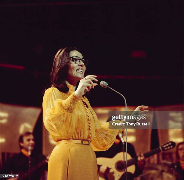 Singer Nana Mouskouri performs on a BBC television show in 1974.