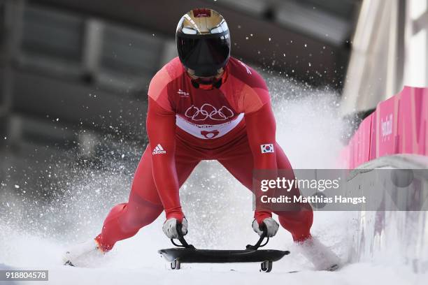 Sungbin Yun of Korea celebrates as he slides into the finish area to win the Men's Skeleton at Olympic Sliding Centre on February 16, 2018 in...