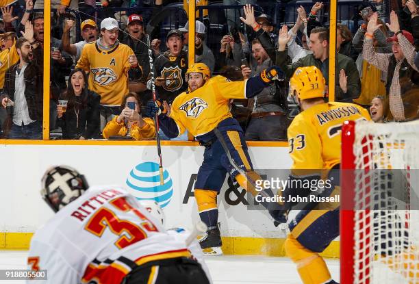 Yannick Weber of the Nashville Predators celebrates his goal against David Rittich of the Calgary Flames during an NHL game at Bridgestone Arena on...