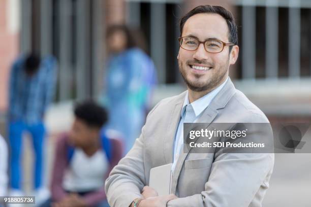 portrait of hispanic male high schools teacher - principal stock pictures, royalty-free photos & images