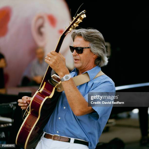 John McLaughlin performs on stage at the Jazz A Vienne Festival held in Vienne, France in July 1998.