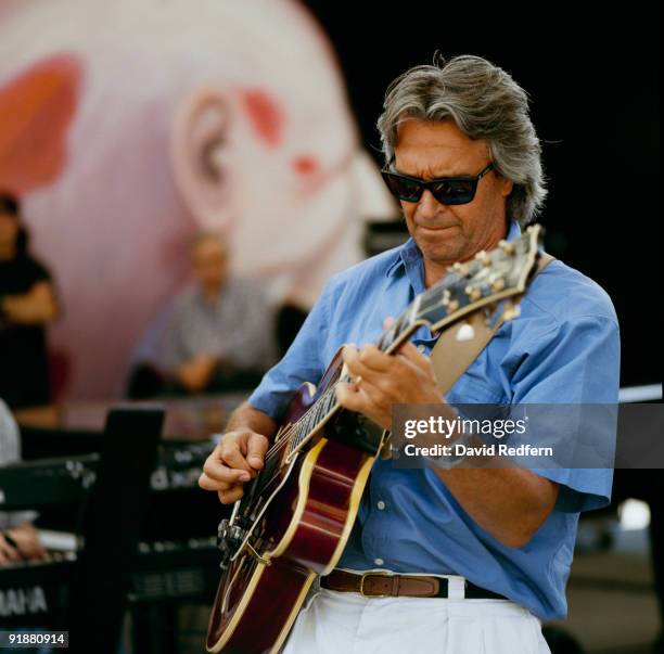John McLaughlin performs on stage at the Jazz A Vienne Festival held in Vienne, France in July 1998.