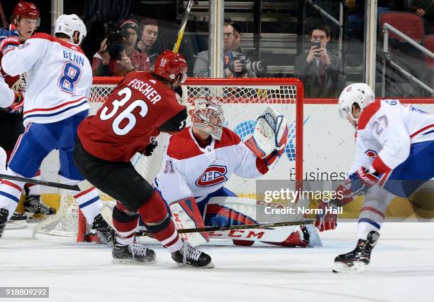 Goalie Carey Price of the Montreal Canadiens makes a glove save on the shot by Christian Fischer of the Arizona Coyotes as Alex Galchenyuk of the...