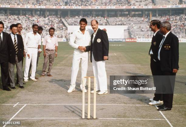 South African captain Clive Rice shakes hands with India captain Mohammad Azharuddin at the coin toss before the 1st ODI between India and South...