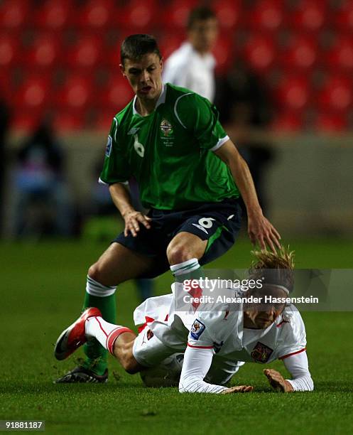 Jaroslav Plasil of Czech Republic is tackled by Christopher Baird of Northern Ireland during the FIFA 2010 World Cup Group 3 Qualifier match between...