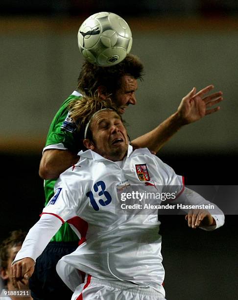 Jaroslav Plasil of Czech Republic battles for the ball with Gareth McAuley of Northern Ireland during the FIFA 2010 World Cup Group 3 Qualifier match...