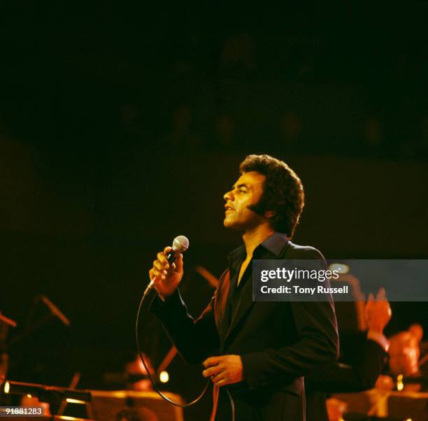 Singer Johnny Mathis performs on stage in London, England in 1977.