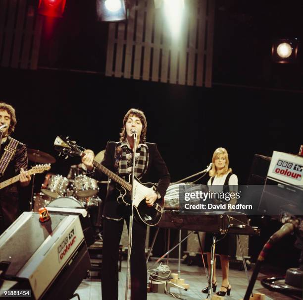 Denny Laine, Paul McCartney and Linda McCartney of Wings perform on Top of the Pops tv show filmed in London, England on November 20, 1974.