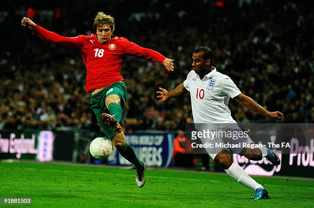 Gabriel Agbonlahor of England challenges Dmitry Verkhovtsov of Belarus during the FIFA 2010 World Cup Group 6 Qualifying match between England and...
