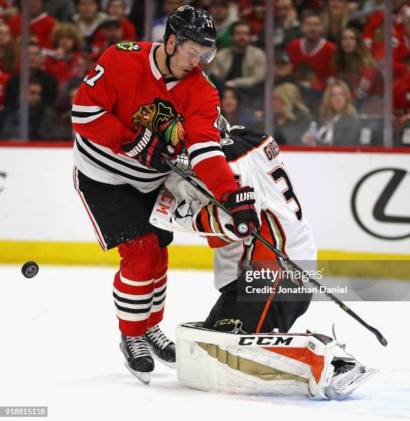 Lance Bouma of the Chicago Blackhawks collides with John Gibson of the Anaheim Ducks at the United Center on February 15, 2018 in Chicago, Illinois.