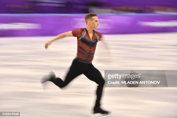 This slow shutter speed exposure shows USA's Adam Rippon warming up before competing in the men's single skating short program of the figure skating...