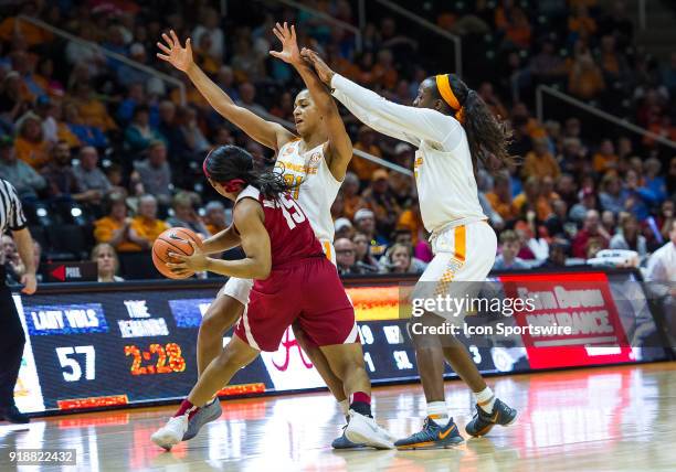 Alabama Crimson Tide guard Meoshonti Knight is double teamed by Tennessee Lady Volunteers guard/forward Jaime Nared and guard Meme Jackson during a...