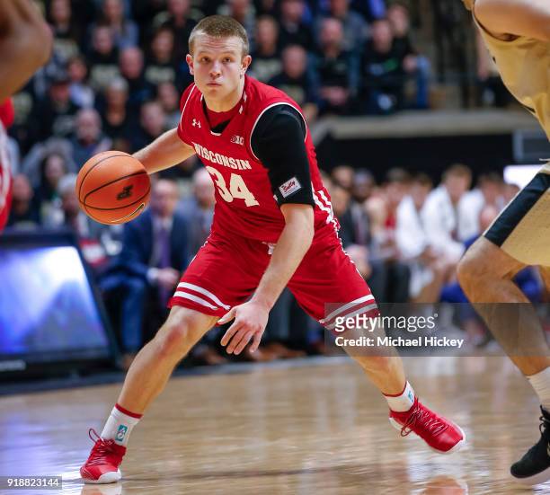 Walt McGrory of the Wisconsin Badgers4 dribbles the ball against the Purdue Boilermakers at Mackey Arena on January 16, 2018 in West Lafayette,...