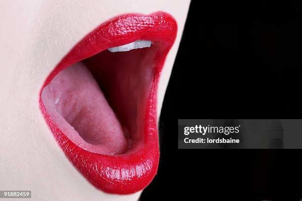 close-up of red lips and open singing mouth - women open mouth stock pictures, royalty-free photos & images