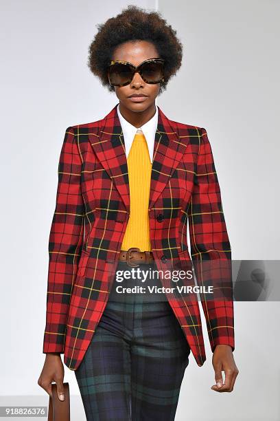 Model walks the runway at the Michael Kors Ready to Wear Fall/Winter 2018-2019 fashion show during New York Fashion Week on February 14, 2018 in New...